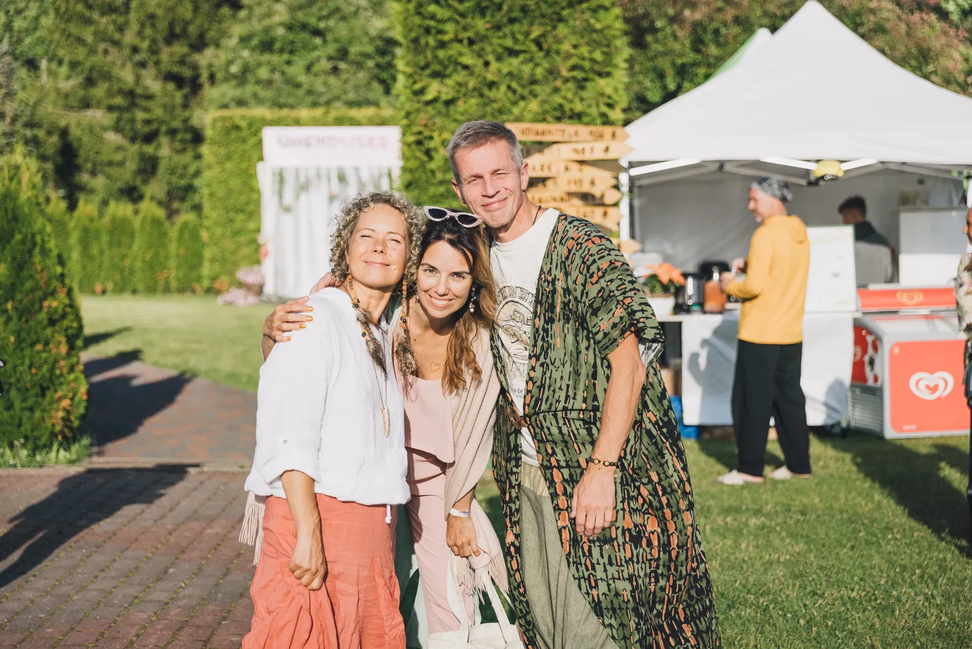 Three friends at the festival entrance