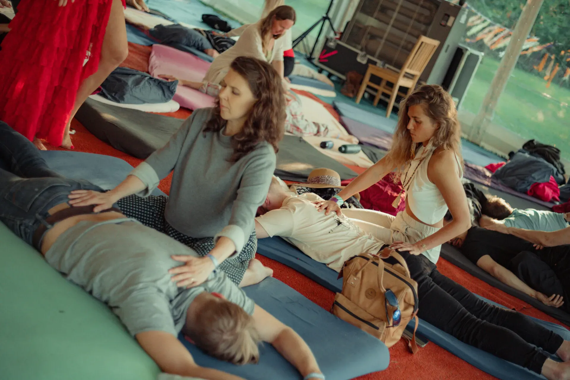 A guided partner exercise in the workshop tent